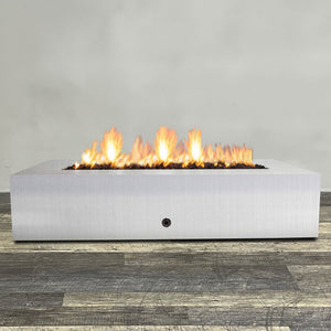 Front view of 72" x 38" Rectangle Gravity Stainless Steel Fire Pit - Natural Gas - Match Lit by Starfire Designs - Brown with flames on, featuring sleek modern design and durable construction, perfect for outdoor patio spaces. Natural gas or propane compatible, enhancing warmth and ambiance. Lava rocks included for added aesthetic.