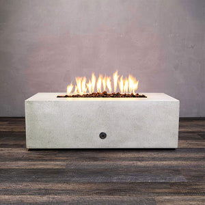 Front view of Starfire Designs Gravity 48" x 32" Rectangle Rustic Gravity Concrete (GFRC) Fire Pit - Propane Gas Hardline - White with flames on, featuring sleek modern concrete bowl design and durable construction, perfect for outdoor patio spaces. Natural gas or propane compatible, enhancing warmth and ambiance. Lava rocks included for added aesthetic.