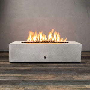 Front view of Starfire Designs Gravity 60" x 32" Rectangle Rustic Gravity Concrete (GFRC) Fire Pit - Propane Gas Hardline - White with flames on, featuring sleek modern concrete bowl design and durable construction, perfect for outdoor patio spaces. Natural gas or propane compatible, enhancing warmth and ambiance. Lava rocks included for added aesthetic.