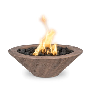 Cazo Woodgrain GFRC fire bowl in warm oak finish, featuring a rustic wood-inspired design with dancing flames over lava rock for a natural yet modern look.