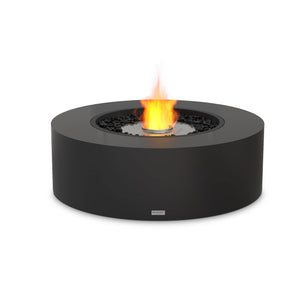 A stylish EcoSmart Fire Ark 40 outdoor fire pit in graphite concrete finish, equipped with a stainless steel ethanol burner. This modern fire feature offers a clean, smokeless burn, surrounded by black fire glass media. Perfect for luxury outdoor seating areas, contemporary patio spaces, and upscale backyard fire pits, combining elegance and high performance.