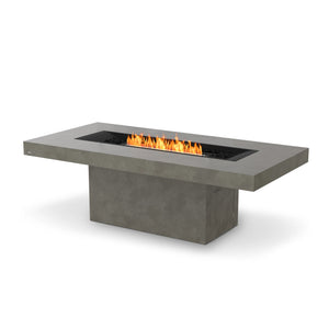 This EcoSmart Fire Gin 90 Dining Height Natural fire table showcases a black burner seamlessly integrated into its concrete tabletop, providing a luxurious and functional centerpiece for any modern outdoor dining space. Designed for both propane and natural gas, this contemporary fire pit delivers warmth and ambiance.