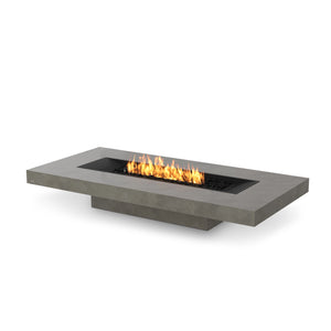 The EcoSmart Fire Gin 90 Low Natural propane fire pit table delivers a sophisticated outdoor heating experience. This rectangular fire pit, with a spacious tabletop and natural concrete finish, is perfect for patios, decks, and backyards. The clean-burning propane burner ensures an eco-friendly and smokeless flame.