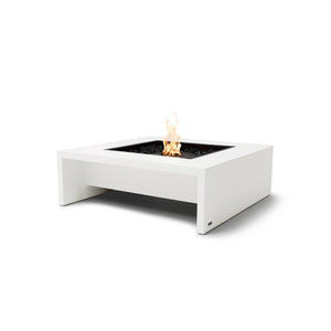 The EcoSmart Fire Mojito 40 Bone is a modern outdoor fire pit table featuring a sleek bone-colored concrete finish with a black burner. This square gas fire pit is designed for contemporary spaces, providing a stunning centerpiece for outdoor patios. The glass-enclosed fire display enhances safety while allowing a clear view of the vibrant flames. Perfect for entertaining guests or relaxing in style, this luxury fire pit is compatible with natural gas or propane.