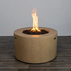 Front view of the Starfire Designs Beton 42" Sand Round Concrete Gas Fire Pit with a steady, bright flame glowing above the lava rocks. The sand-colored surface provides a modern yet natural appearance for any outdoor space.