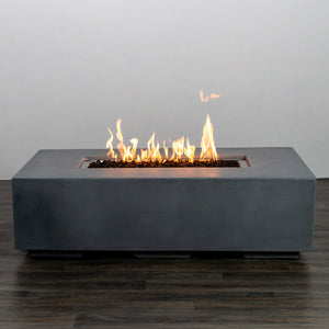 Starfire Designs Beton 55-inch natural gray rectangle gas fire pit with flames fully lit, creating a warm and inviting ambiance for any outdoor setting. The natural gray finish contrasts beautifully against the glowing fire, enhancing the aesthetic appeal of patios and decks.