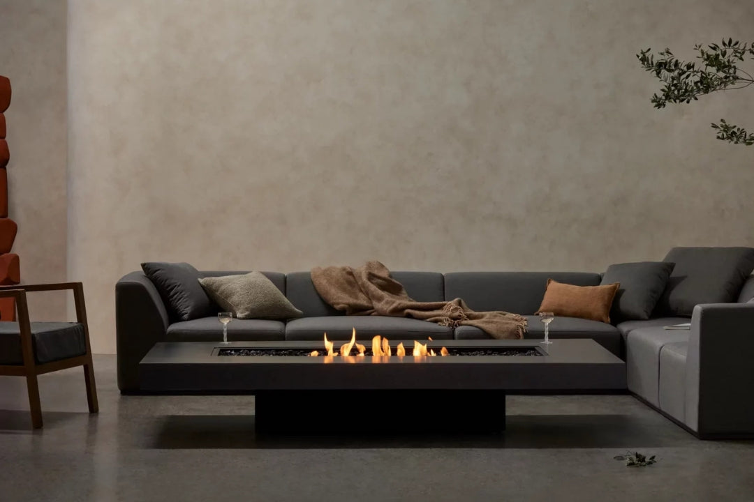 Rectangular ethanol fire pit coffee table with linear flame in a modern living room