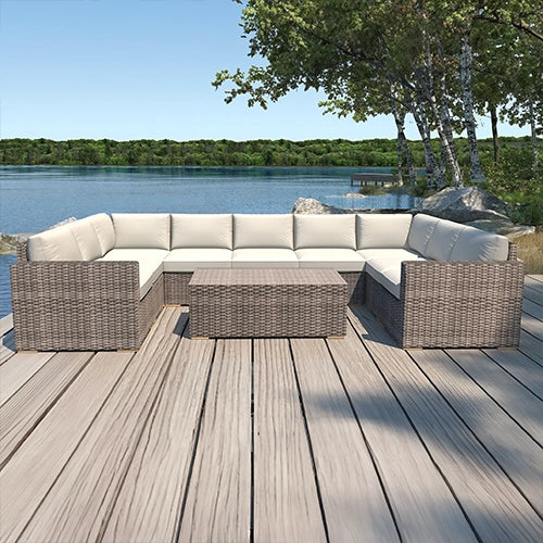 Dune Sectional Set by Harmonia Living on a wooden deck next to a pond