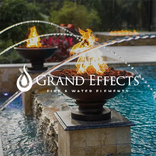 Grand Effects fire and water feature showcasing elegant fire bowls with vibrant flames and flowing water arches over a luxury pool, creating a stunning centerpiece for outdoor ambiance and style.