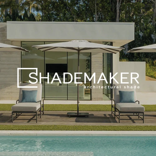Shademaker modern outdoor umbrella providing stylish architectural shade over poolside lounge chairs, ideal for luxury outdoor spaces, patio design, shade solutions, and contemporary outdoor living.