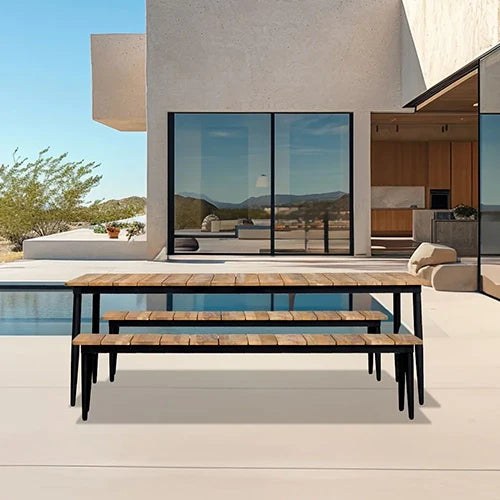  A modern outdoor picnic set with a natural wood dining table and two matching wood benches, featuring sturdy black metal legs and a sleek industrial aesthetic, perfectly placed beside a luxurious poolside patio.