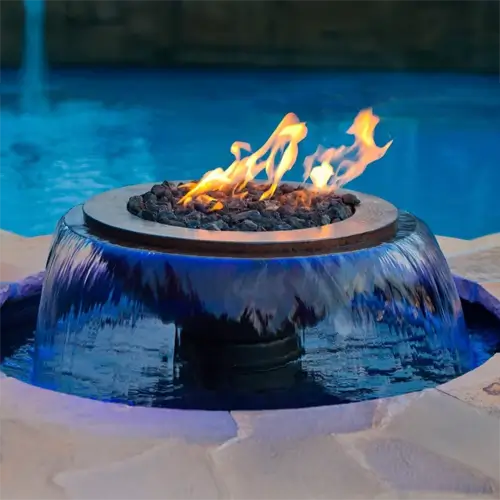 a submersibe fire feature component spraying in a 360 direction into a pool area