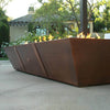 Side view of the Starfire Designs 10ft Copper Spartan Gas Fire Pit, featuring a sleek, angular design with a hammered copper finish, perfect for modern outdoor settings