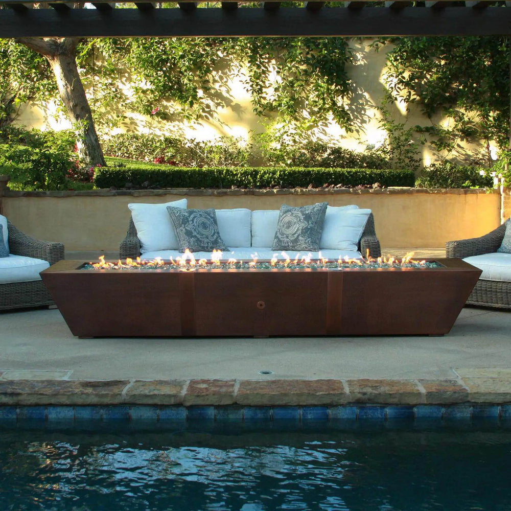 Luxurious poolside setup featuring the 10ft Copper Spartan Gas Fire Pit, perfect for upscale outdoor gatherings