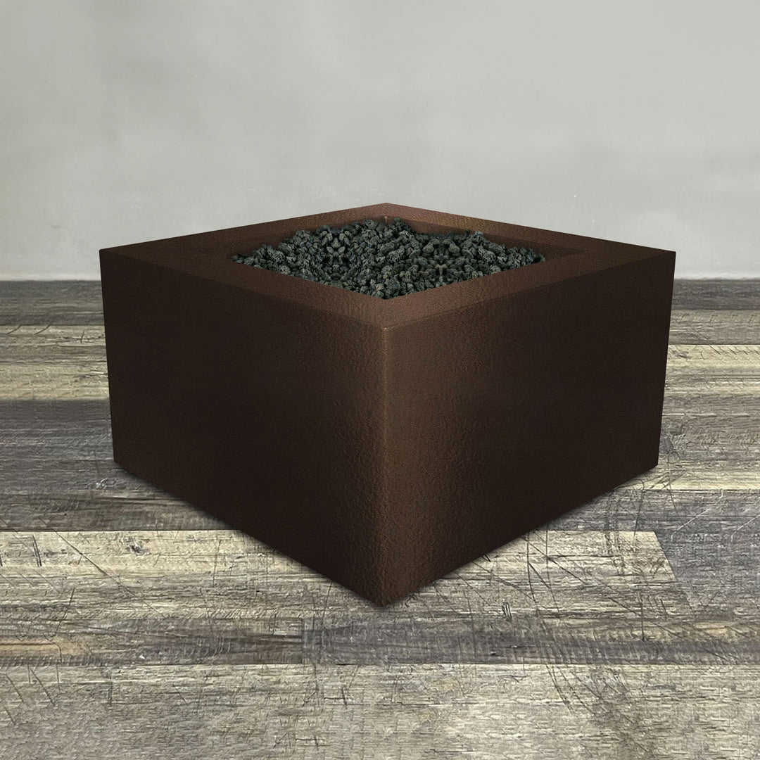 A side view of the 36" Square Gravity Powder Coated Steel Fire Pit - Propane Gas Hardline - Flame Sense with Spark Ignition System - Bronze Hammertone by Starfire Designs - perfect for outdoor patio spaces. Natural gas or propane compatible, enhancing warmth and ambiance. Lava rocks included for added aesthetic.