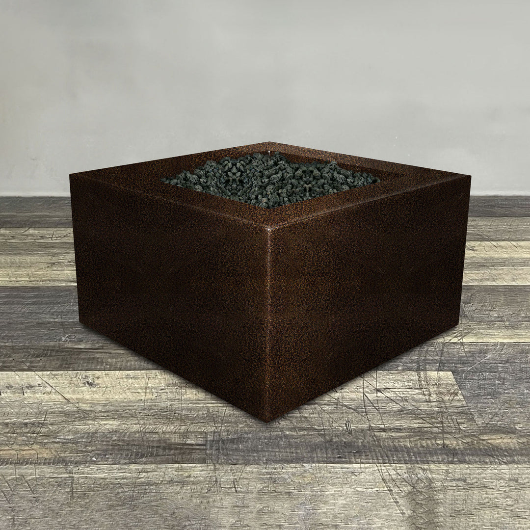 A side view of the 36" Square Gravity Powder Coated Steel Fire Pit - Propane Gas Hardline - Flame Sense with Spark Ignition System - Copper Vein by Starfire Designs - perfect for outdoor patio spaces. Natural gas or propane compatible, enhancing warmth and ambiance. Lava rocks included for added aesthetic.