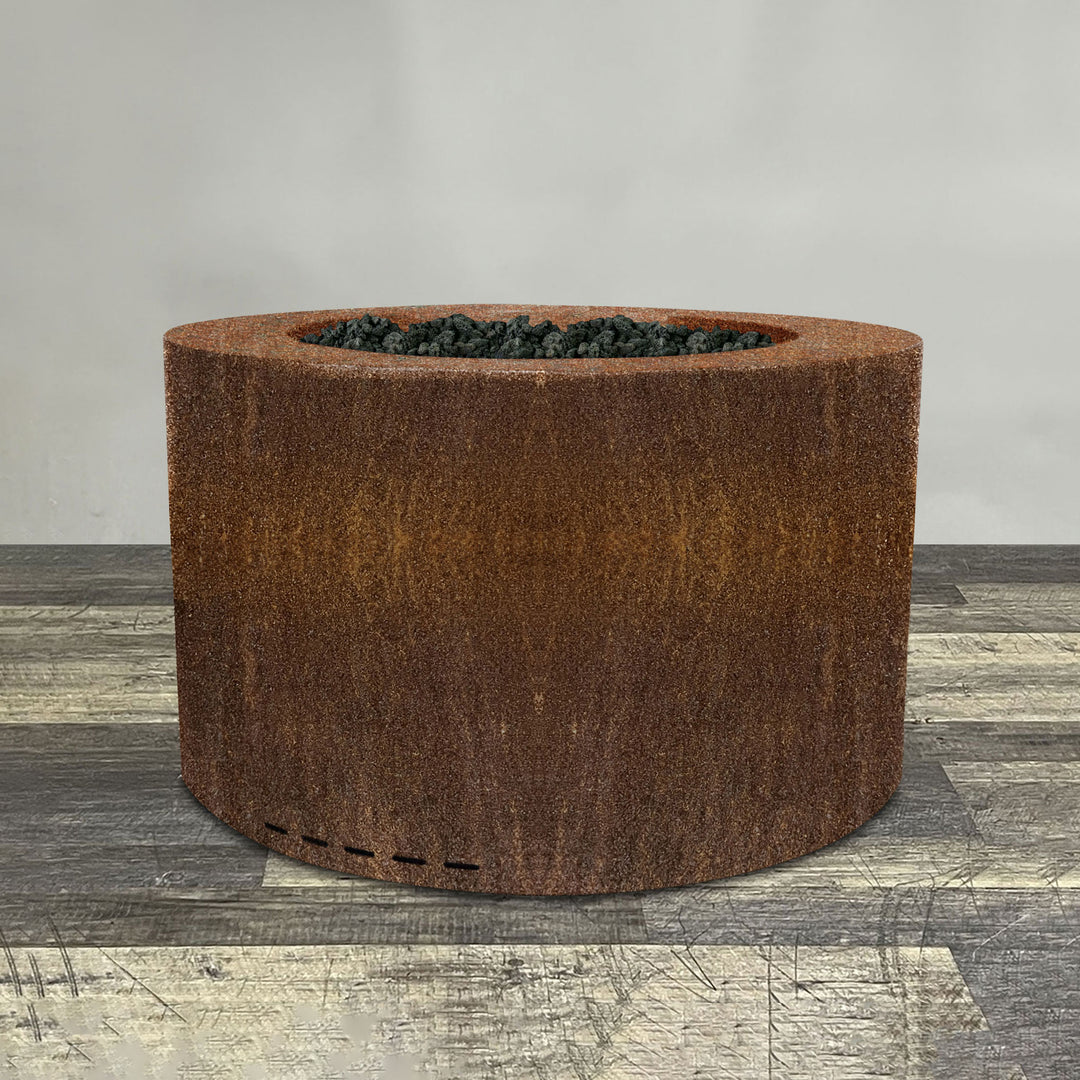 A side view of the 36" Round Gravity Corten Steel Fire Pit by Starfire Designs - perfect for outdoor patio spaces. Natural gas or propane compatible, enhancing warmth and ambiance. Lava rocks included for added aesthetic.