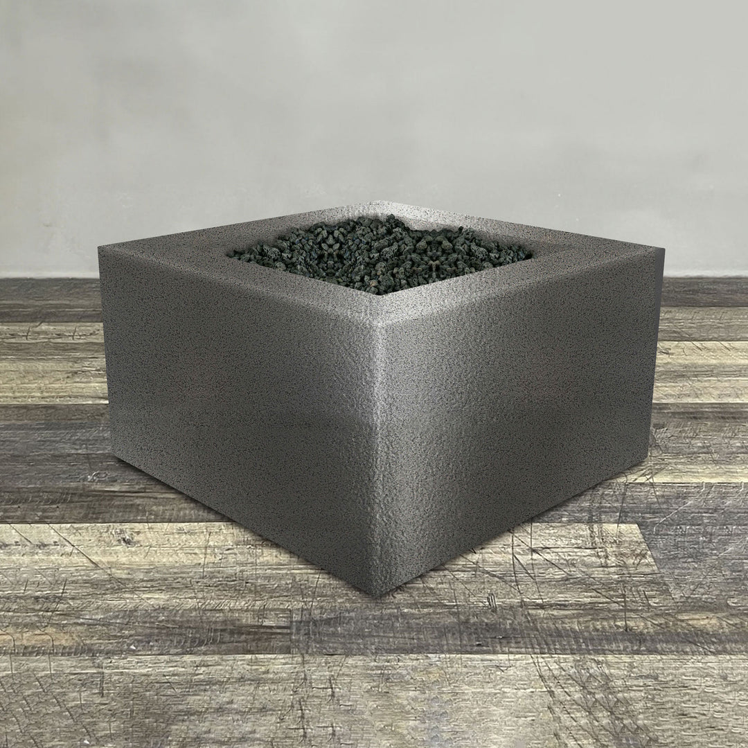 A side view of the 36" Square Gravity Powder Coated Steel Fire Pit - Propane Gas Hardline - Flame Sense with Spark Ignition System - Silver Hammertone by Starfire Designs - perfect for outdoor patio spaces. Natural gas or propane compatible, enhancing warmth and ambiance. Lava rocks included for added aesthetic.