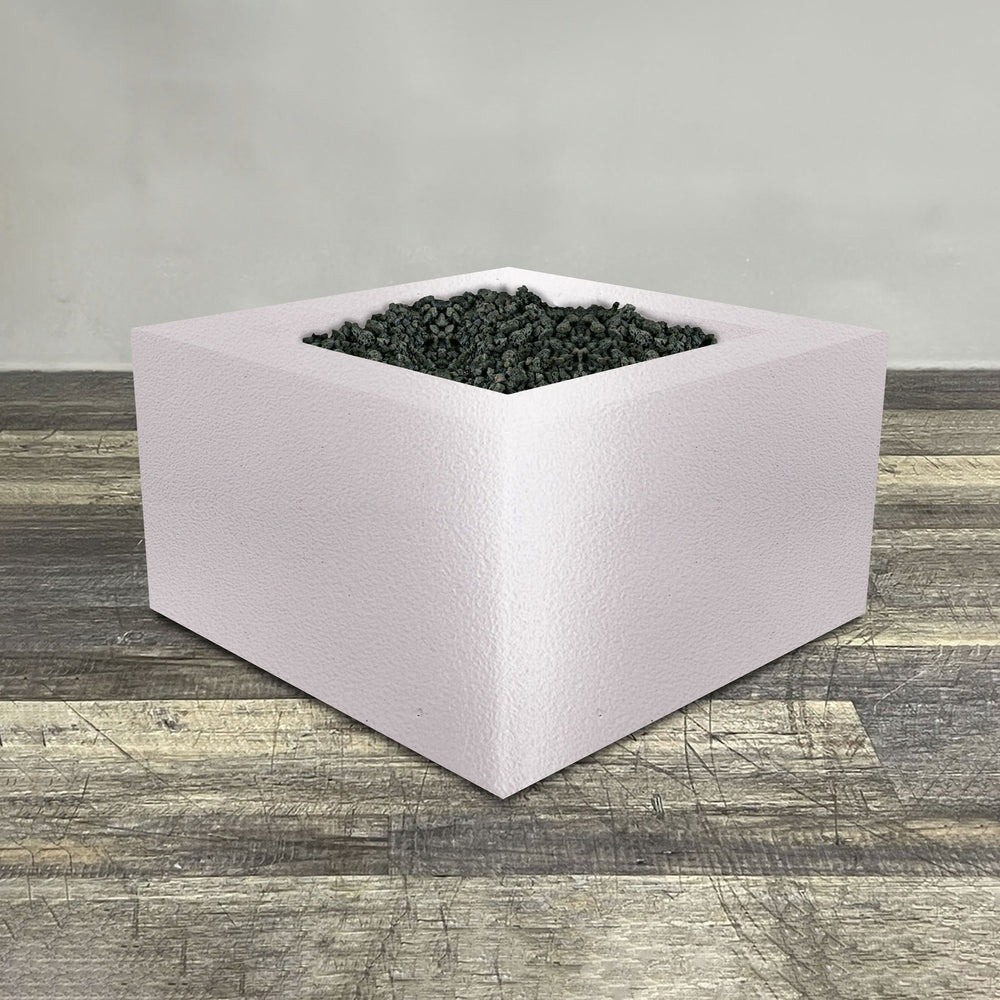 A side view of the 36" Square Gravity Powder Coated Steel Fire Pit - Propane Gas Hardline - Flame Sense with Spark Ignition System - White Hammertone by Starfire Designs - perfect for outdoor patio spaces. Natural gas or propane compatible, enhancing warmth and ambiance. Lava rocks included for added aesthetic.