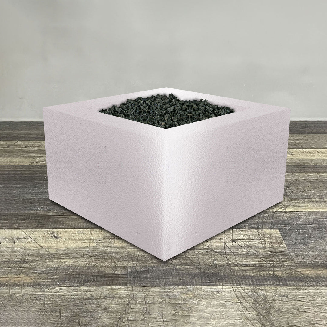 A side view of the 36" Square Gravity Powder Coated Steel Fire Pit - Propane Gas Hardline - Flame Sense with Spark Ignition System - White Hammertone by Starfire Designs - perfect for outdoor patio spaces. Natural gas or propane compatible, enhancing warmth and ambiance. Lava rocks included for added aesthetic.