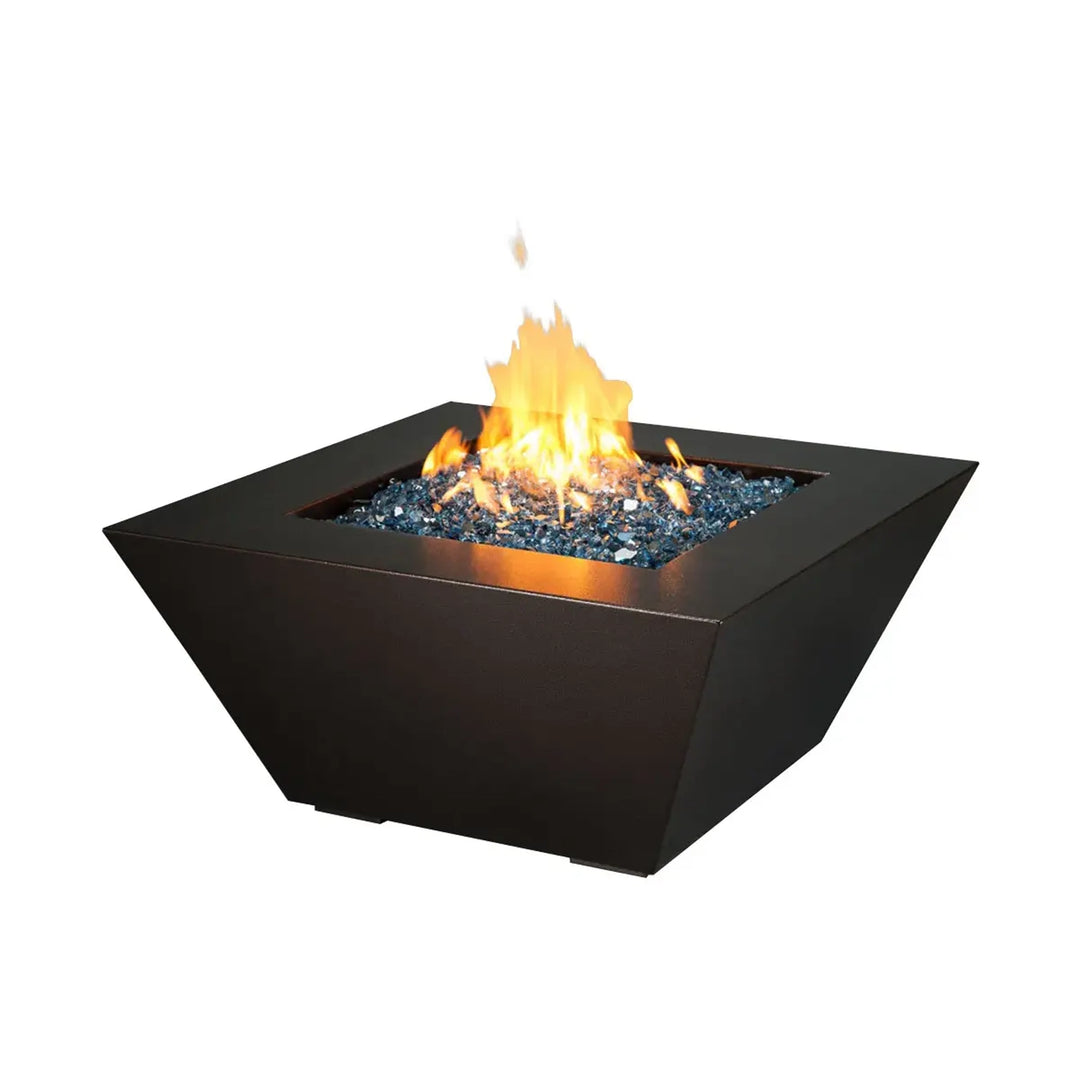 Modern square fire pit with blue fire glass and bright flames, set against a white background