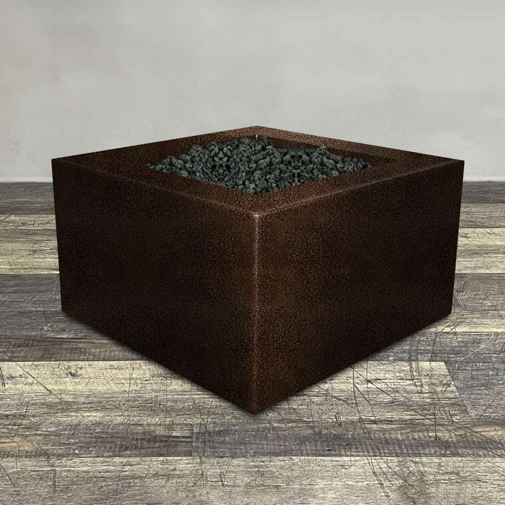 A side view of the 45" Square Gravity Powder Coated Steel Fire Pit - Natural Gas - 110V Electronic Ignition System - Copper Vein by Starfire Designs - perfect for outdoor patio spaces. Natural gas or propane compatible, enhancing warmth and ambiance. Lava rocks included for added aesthetic.