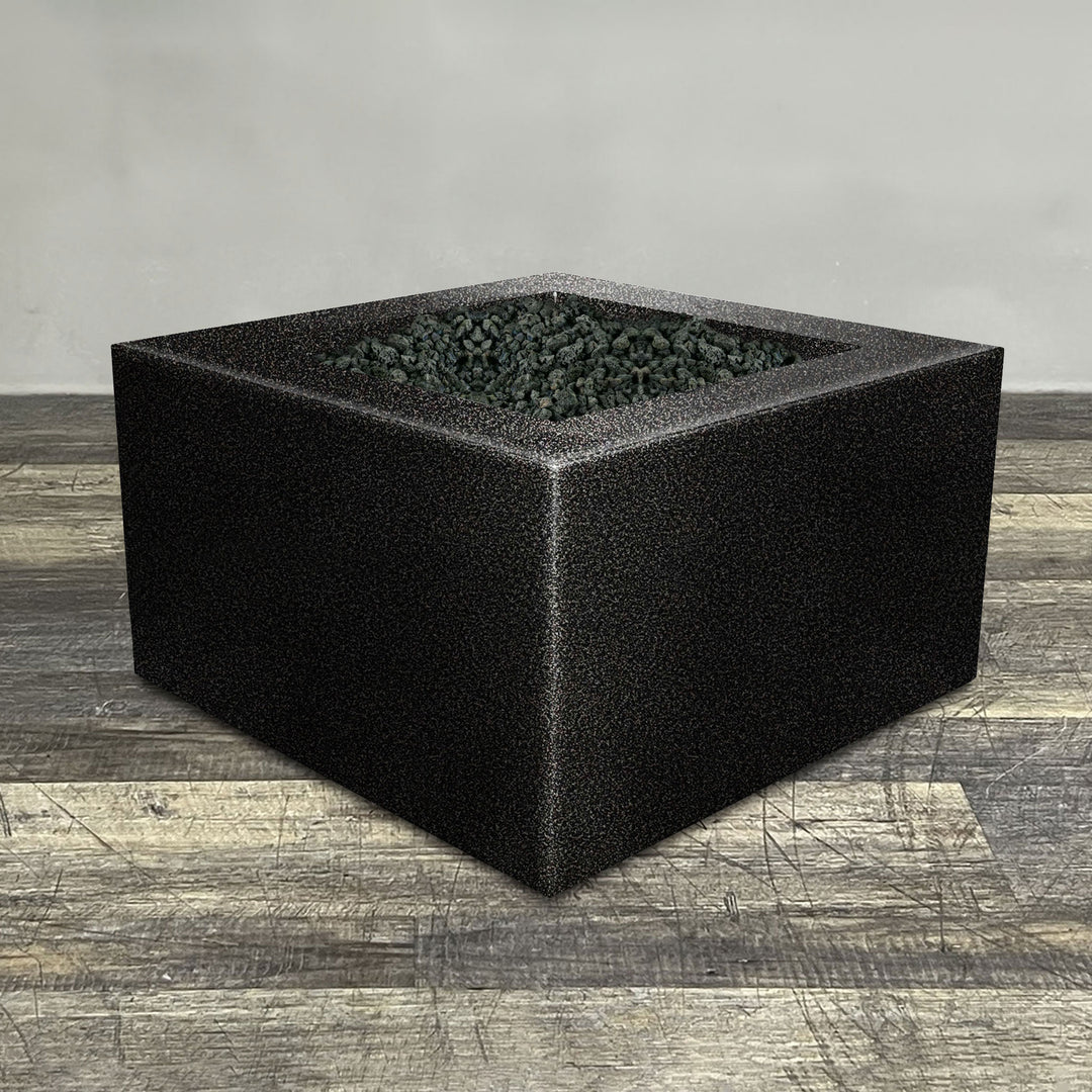 A side view of the 45" Square Gravity Powder Coated Steel Fire Pit - Natural Gas - 110V Electronic Ignition System - Silver Vein by Starfire Designs - perfect for outdoor patio spaces. Natural gas or propane compatible, enhancing warmth and ambiance. Lava rocks included for added aesthetic.