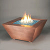 8-inch Copper Canyon gas fire pit by Starfire Designs, featuring blue fire glass and a hammered copper finish, ideal for creating a modern outdoor fire pit ambiance