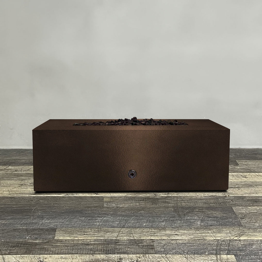 A side view of the 48" x 24" Rectangle Gravity Powder Coated Steel Fire Pit - Propane Gas Hardline - 110V CSA Hi/Lo Electronic Ignition System w/Bluetooth & Handheld Remote - Bronze Hammertone by Starfire Designs - perfect for outdoor patio spaces. Natural gas or propane compatible, enhancing warmth and ambiance. Lava rocks included for added aesthetic.