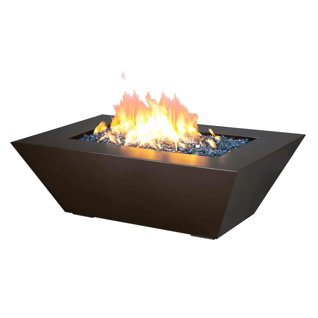 Trapezoidal modern fire pit filled with blue fire glass, emitting vibrant flames, set against a plain white background.