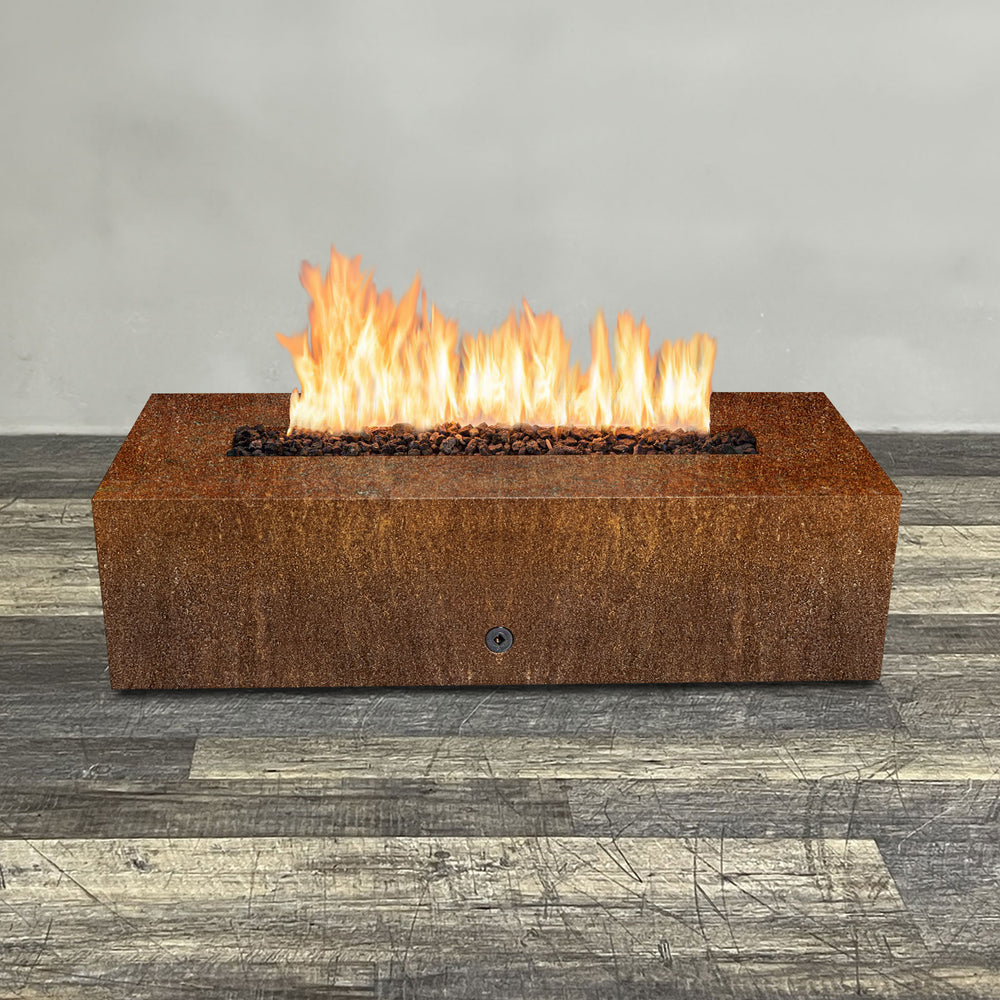 A side view of the 60" x 24" Rectangle Gravity Corten Steel Fire Pit by Starfire Designs - perfect for outdoor patio spaces. Natural gas or propane compatible, enhancing warmth and ambiance. Lava rocks included for added aesthetic.