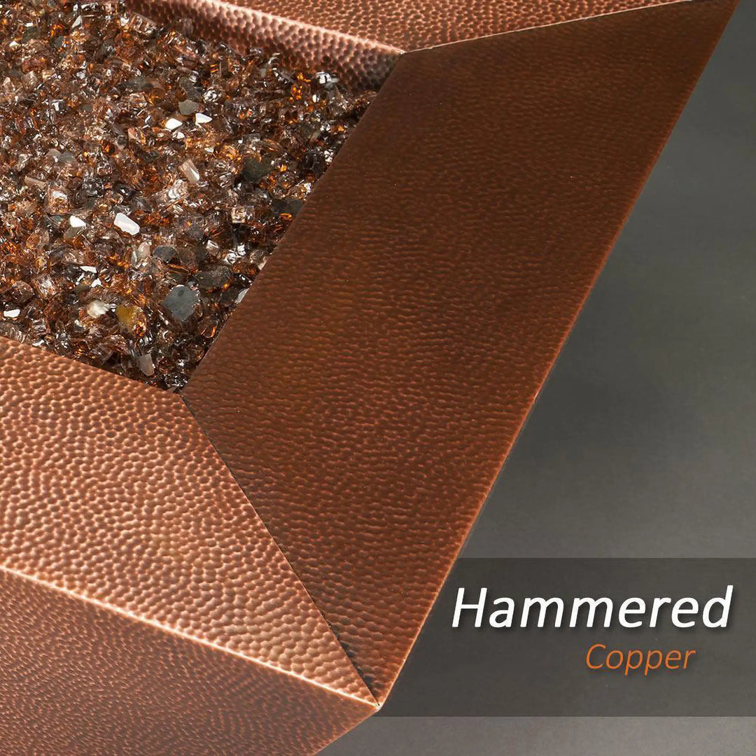 Detail view of the 60" x 32" Copper Canyon gas fire pit by Starfire Designs, showcasing the hammered copper finish and intricate design, perfect for upscale outdoor spaces