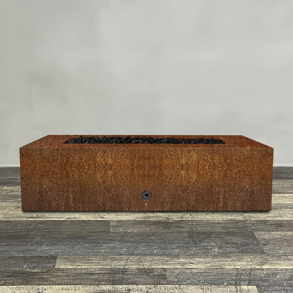 A side view of the 60" x 32" Rectangle Gravity Corten Steel Fire Pit by Starfire Designs - perfect for outdoor patio spaces. Natural gas or propane compatible, enhancing warmth and ambiance. Lava rocks included for added aesthetic.