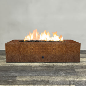 Front view of 60" x 32" Rectangle Gravity Corten Steel Fire Pit by Starfire Designs - Brown with flames on, featuring sleek modern design and durable construction, perfect for outdoor patio spaces. Natural gas or propane compatible, enhancing warmth and ambiance. Lava rocks included for added aesthetic.