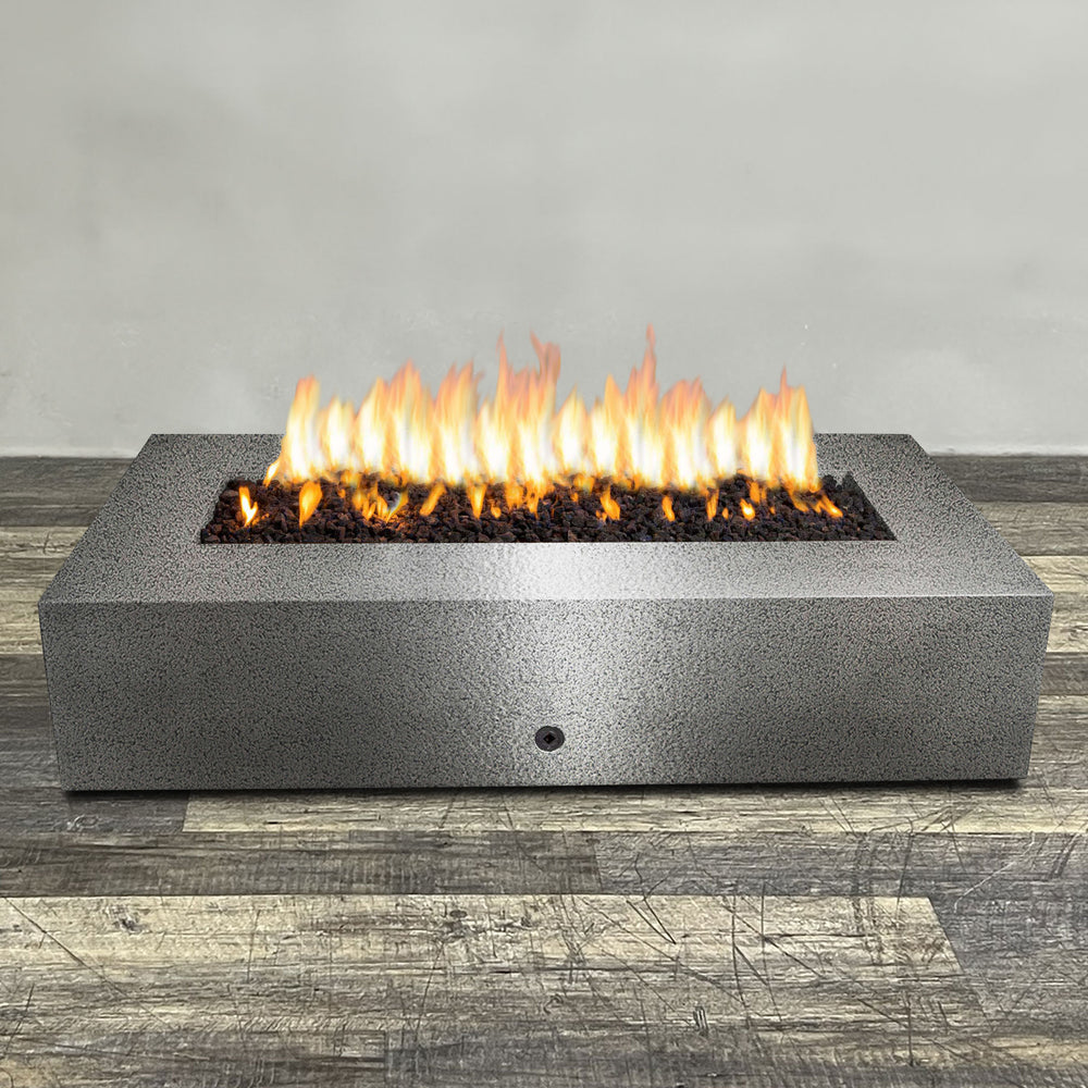 A side view of the 72" x 38" Rectangle Gravity Powder Coated Steel Fire Pit - Propane Gas Hardline - 110V CSA Hi/Lo Electronic Ignition System w/Bluetooth & Handheld Remote - Silver Hammertone by Starfire Designs - perfect for outdoor patio spaces. Natural gas or propane compatible, enhancing warmth and ambiance. Lava rocks included for added aesthetic.