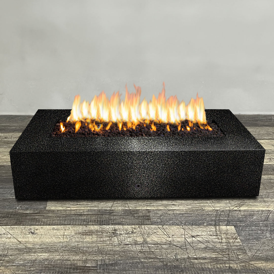 A side view of the 72" x 38" Rectangle Gravity Powder Coated Steel Fire Pit - Propane Gas Hardline - 110V CSA Hi/Lo Electronic Ignition System w/Bluetooth & Handheld Remote - Silver Vein by Starfire Designs - perfect for outdoor patio spaces. Natural gas or propane compatible, enhancing warmth and ambiance. Lava rocks included for added aesthetic.