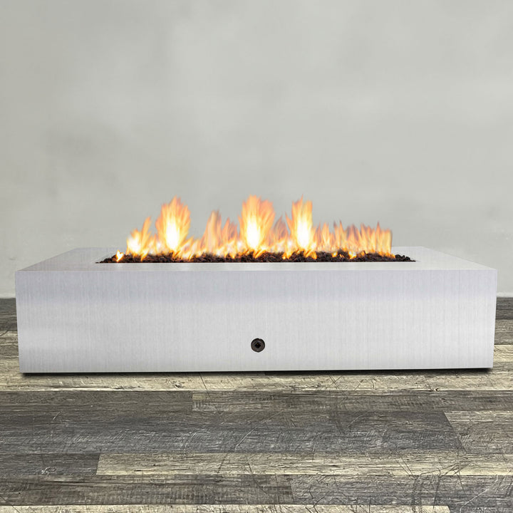 Front view of 72" x 38" Rectangle Gravity Stainless Steel Fire Pit - Natural Gas - Match Lit by Starfire Designs - Brown with flames on, featuring sleek modern  design and durable construction, perfect for outdoor patio spaces. Natural gas or propane compatible, enhancing warmth and ambiance. Lava rocks included for added aesthetic.