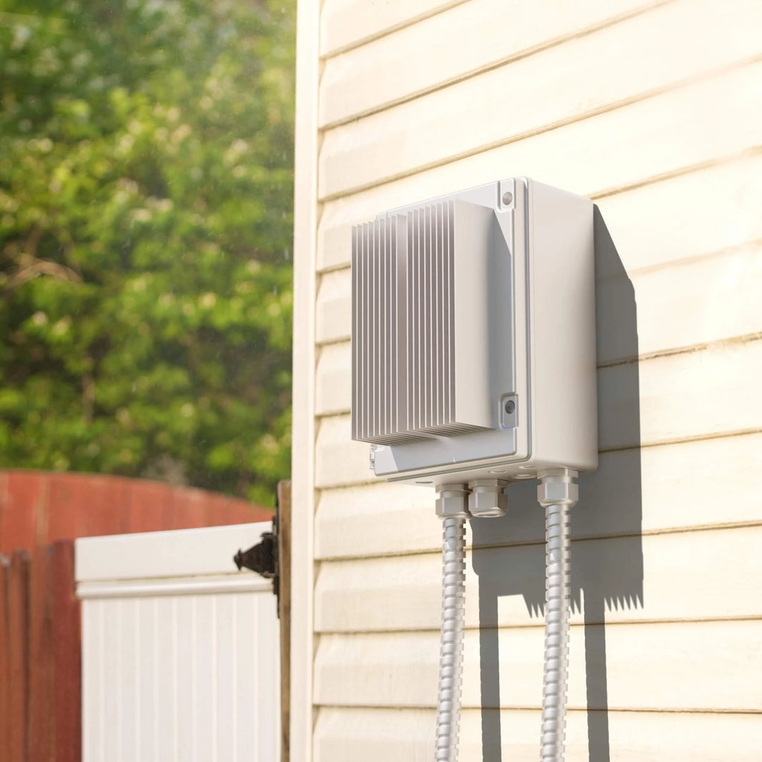 “Bromic 2-Channel Smart-Heat Dimmer Control installed on an exterior wall in a backyard setting, showing weatherproof housing and reliable outdoor heater integration.”