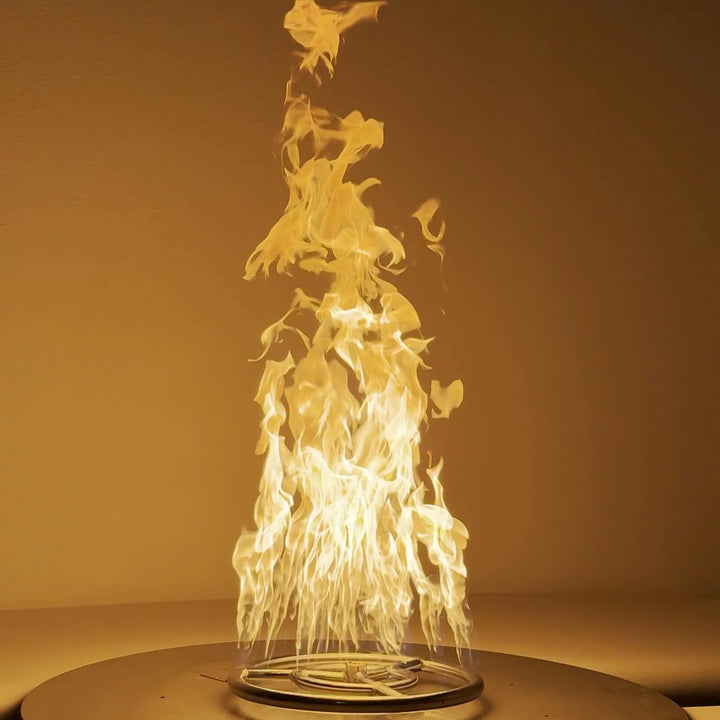 Athena Fire Glass 12-Inch Fire Ring Burner in action, displaying tall, vibrant flames that showcase the burner's superior airflow and efficient combustion design for premium fire feature installations.
