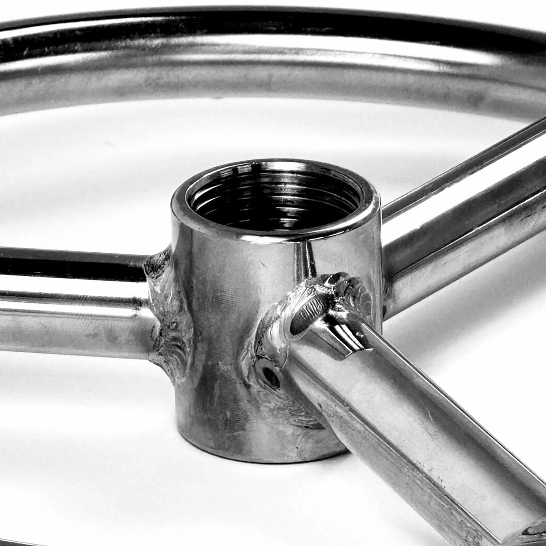 Close-up of the Athena Fire Glass fire ring center hub, featuring precision threading and welded joints that ensure a secure gas connection for sizes ranging from 6 to 36 inches.