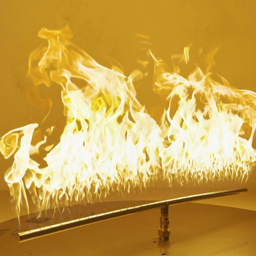 Athena Fire Glass 36-Inch Linear T-Burner producing tall, even flames across a stainless steel burner bar—showcasing powerful 520,000 BTU output for gas fire pits.