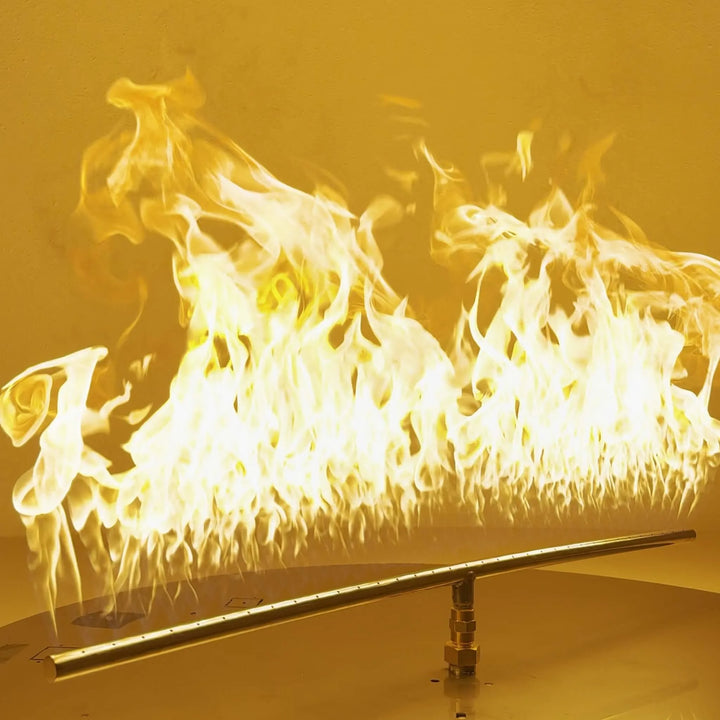 Athena Fire Glass 36-Inch Linear T-Burner producing tall, even flames across a stainless steel burner bar—showcasing powerful 520,000 BTU output for gas fire pits.