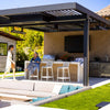 Contemporary backyard with Bromic Tungsten Electric Smart-Heat heater mounted above an outdoor kitchen and bar area, offering year-round comfort in a stylish entertainment space.