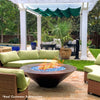 Cono Moreno 48-inch Round Copper Fire Pit in a lush outdoor setting, with cozy seating, displaying real customer use