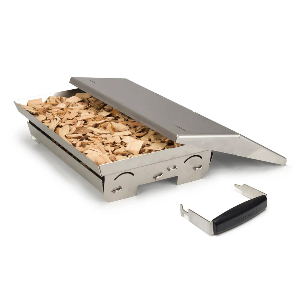 Fire Magic Charcoal Smoker Basket for A54 and A43 Grills on a white background filled to the brim with wood chips