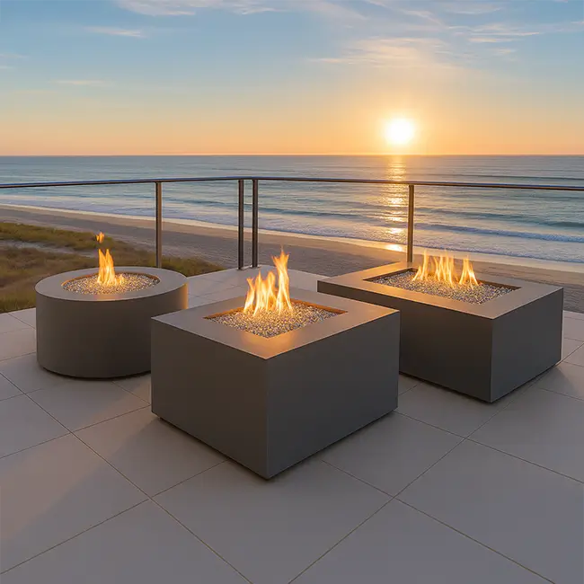 3 Beton concrete fire pits are sitting on a beach atmosphere at sunset