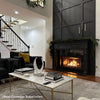 Elegant living room with a black paneled fireplace, marble coffee table, and modern decor, showcasing a cozy and stylish space perfect for relaxation