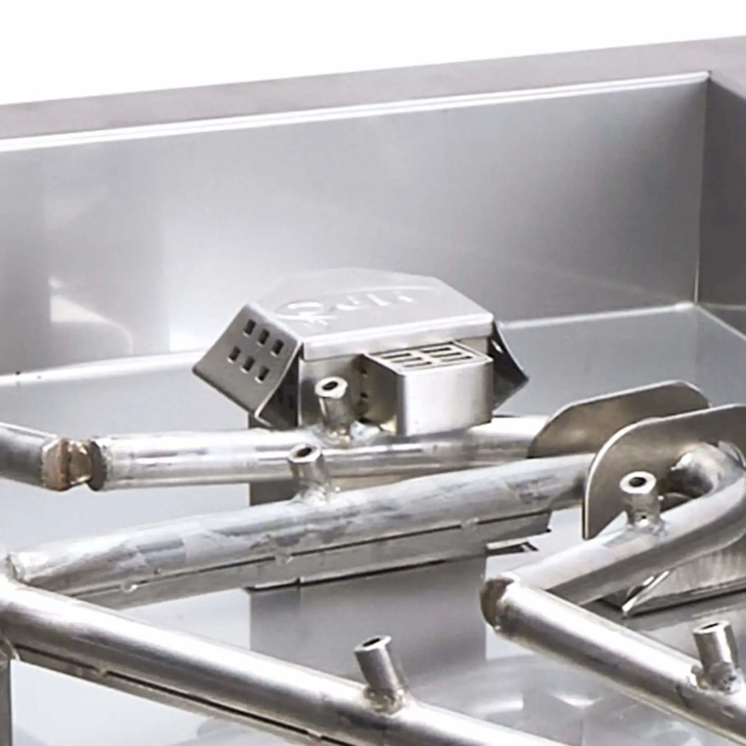 Detailed close-up of the HPC Fire blow-out box, showcasing the rugged stainless steel construction and protective housing for the Torpedo Penta Burner ignition components. This image highlights the meticulous craftsmanship and safety-first engineering that help ensure reliable performance in wind-prone outdoor environments.