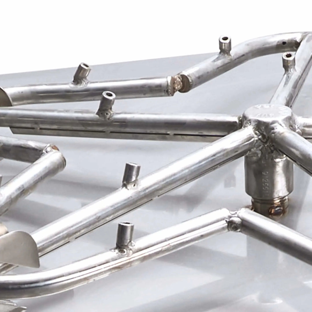 Detailed close-up of the flat Torpedo Penta burner arms by HPC Fire, showing the high-efficiency gas ports and welded stainless steel tubing / crafted for powerful, consistent flame performance.