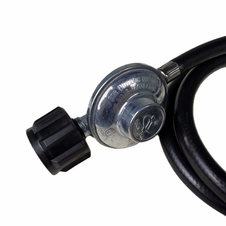 Detailed view of the Starfire Designs Béton Fire Pit Replacement Regulator showing the LP gas label and sturdy metal construction for safe propane flow control.